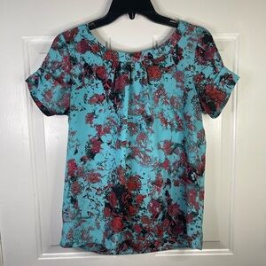 Kenzie short sleeve‎ pattern blouse in blue and pink. Tie in the back